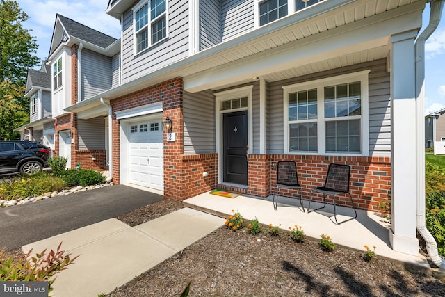 view of front of house with a porch and a garage