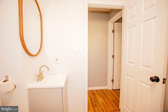 bathroom featuring vanity and hardwood / wood-style flooring