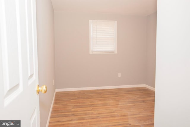 spare room with light hardwood / wood-style floors