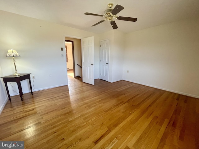 unfurnished bedroom with hardwood / wood-style flooring and ceiling fan