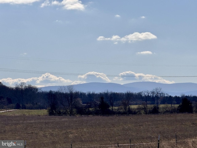 mountain view featuring a rural view