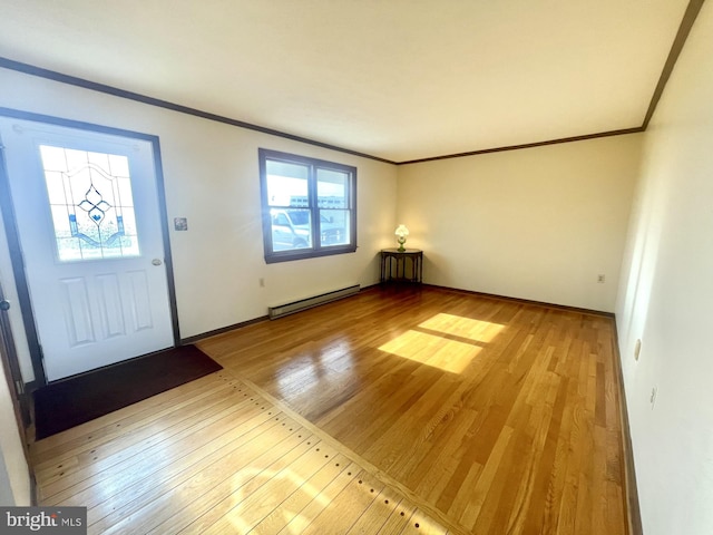 foyer featuring crown molding, light hardwood / wood-style flooring, and baseboard heating