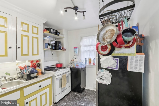 kitchen with white range with gas stovetop and sink