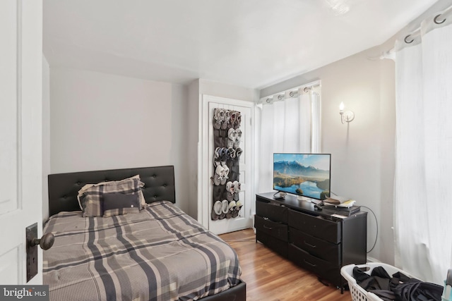 bedroom with light hardwood / wood-style floors