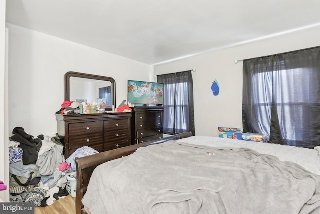 bedroom with wood-type flooring