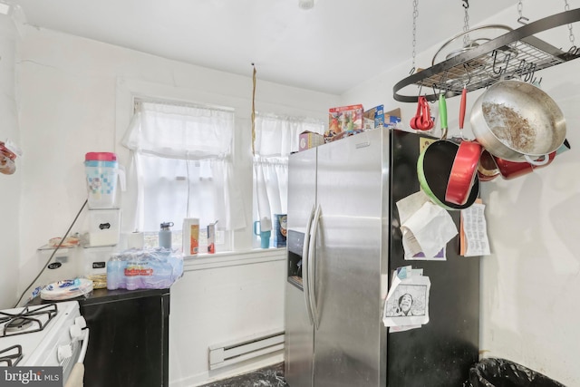 kitchen featuring white range oven, white cabinetry, baseboard heating, and stainless steel refrigerator with ice dispenser