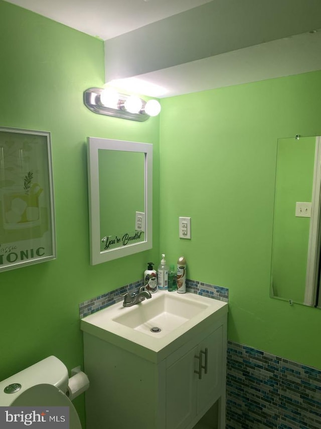 bathroom with vanity and toilet