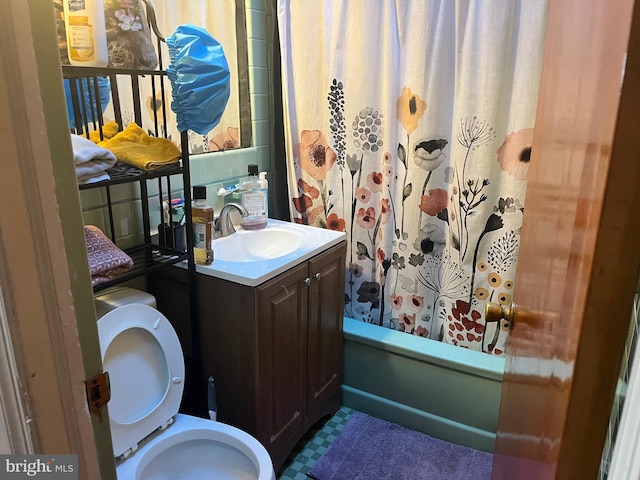 full bathroom with shower / bath combo, toilet, and vanity