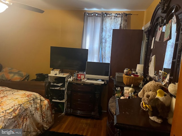 bedroom featuring hardwood / wood-style flooring and ceiling fan