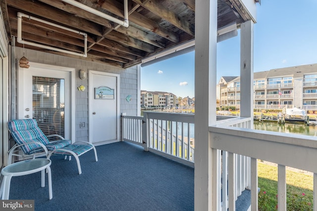 balcony featuring a water view