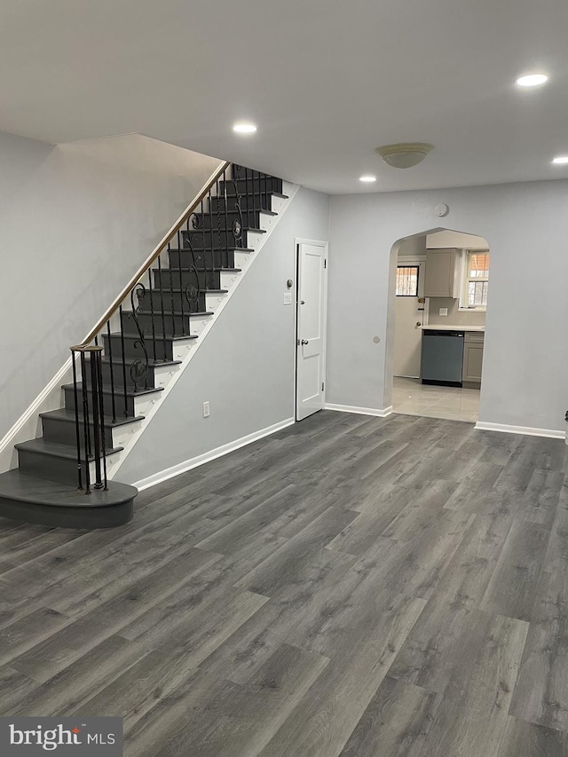 unfurnished living room featuring wood-type flooring