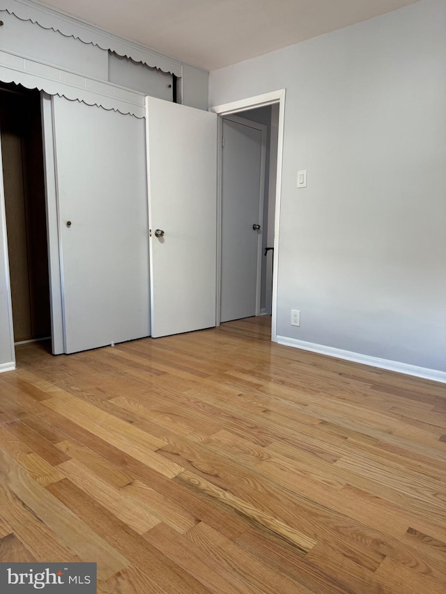 unfurnished bedroom featuring light hardwood / wood-style floors