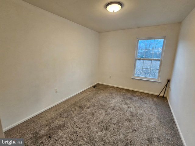 spare room featuring carpet floors