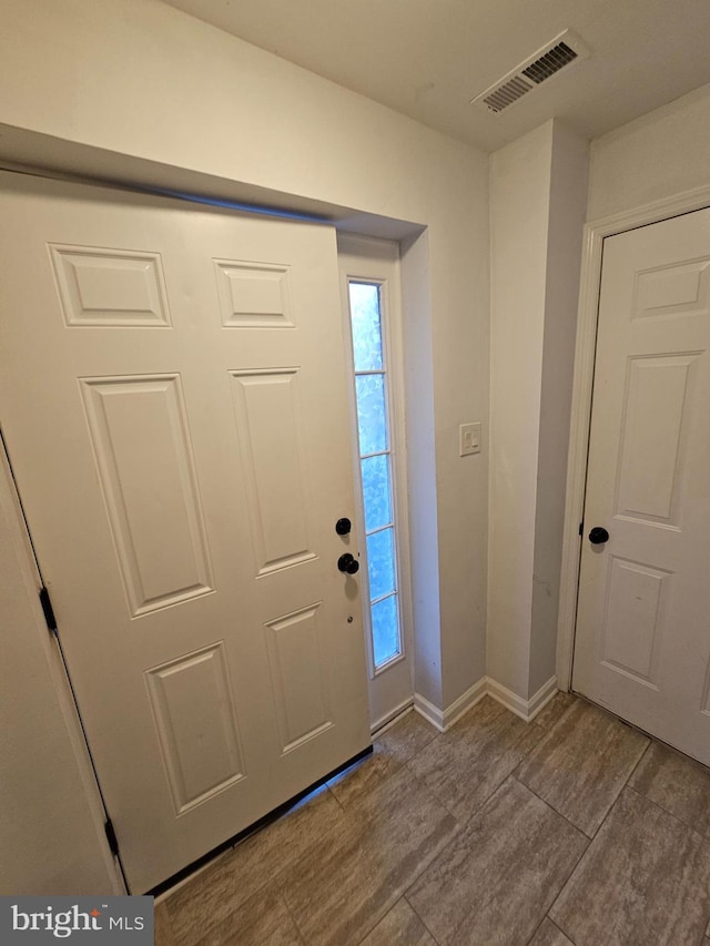 entryway with light hardwood / wood-style flooring