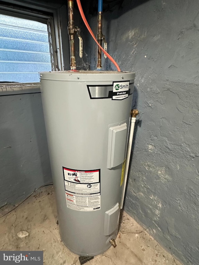 utility room with electric water heater