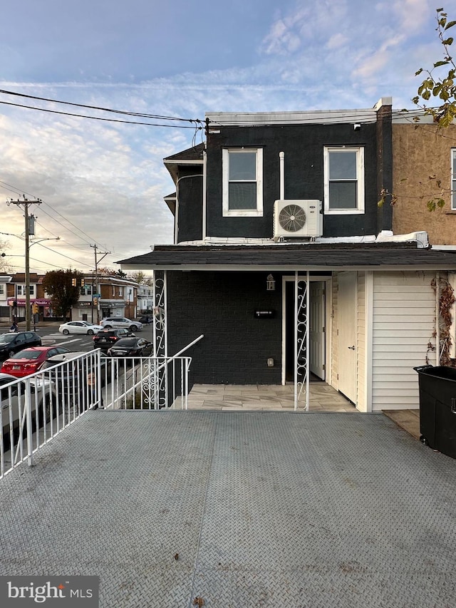 view of front of property with ac unit