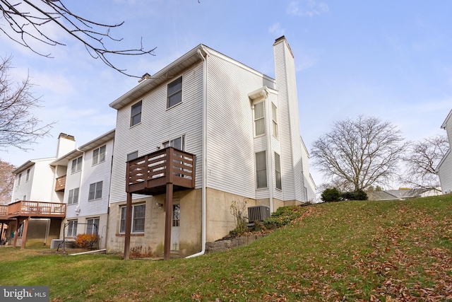 view of property exterior with a yard and cooling unit