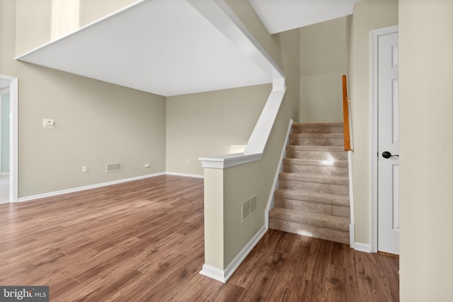 stairway with wood-type flooring