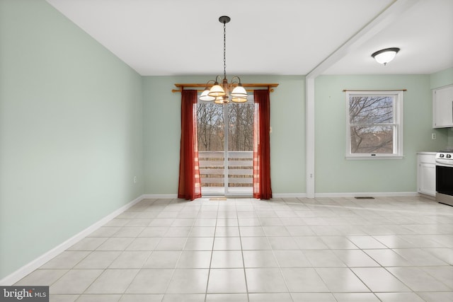 unfurnished dining area featuring a notable chandelier and light tile patterned flooring