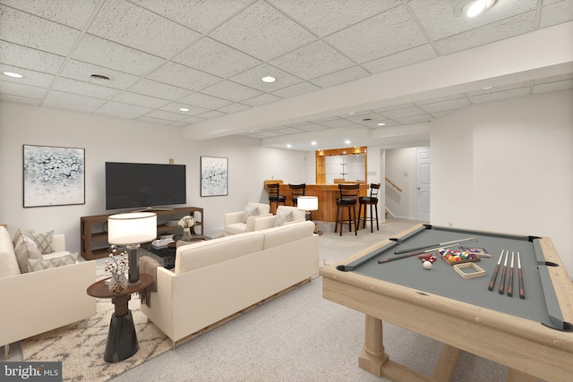 recreation room with a paneled ceiling, light carpet, pool table, and indoor bar