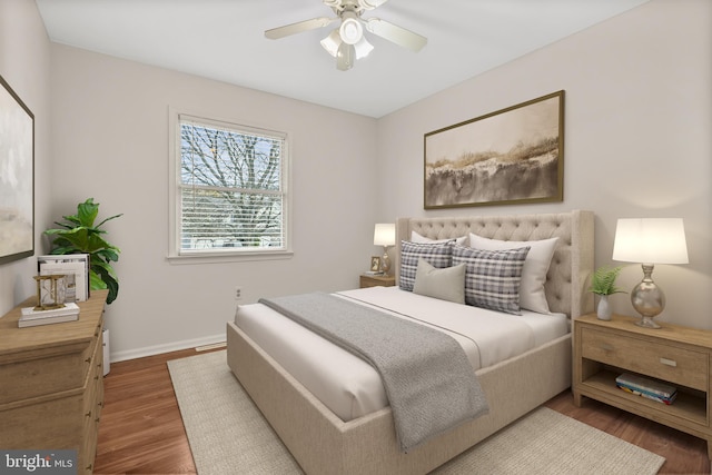 bedroom featuring ceiling fan and hardwood / wood-style flooring