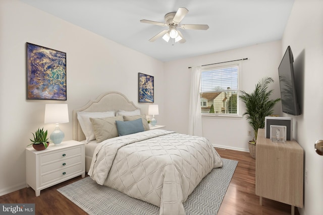 bedroom with ceiling fan and dark hardwood / wood-style flooring