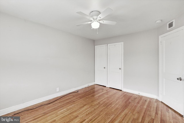 unfurnished bedroom with ceiling fan and light hardwood / wood-style floors