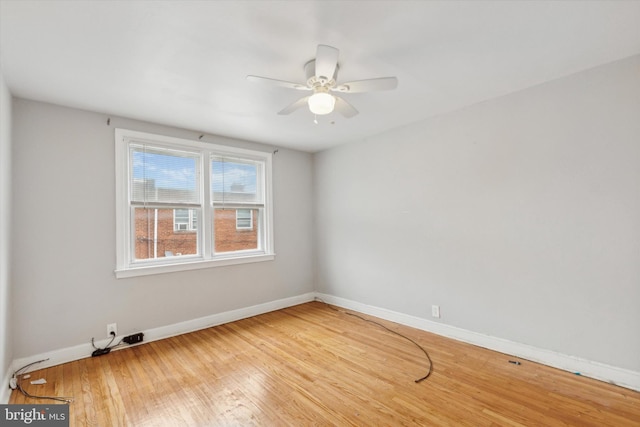 spare room featuring ceiling fan and light hardwood / wood-style floors