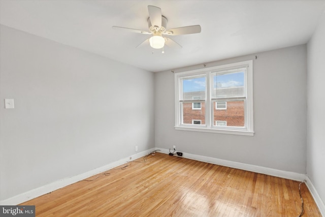 empty room featuring ceiling fan and light hardwood / wood-style flooring