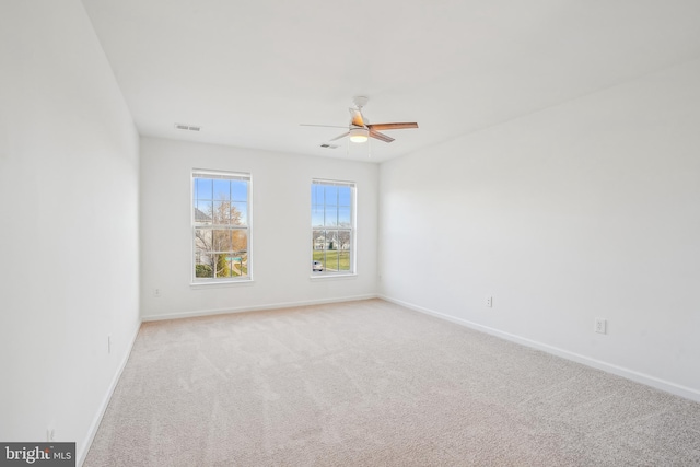 carpeted empty room with ceiling fan