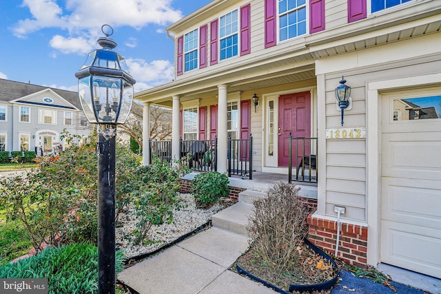 entrance to property featuring a porch