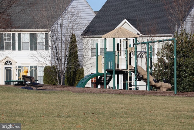 view of jungle gym featuring a lawn