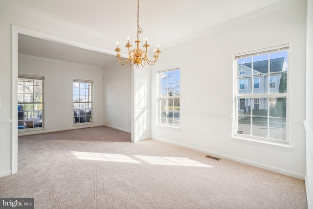 unfurnished room with a chandelier, light colored carpet, and ornamental molding