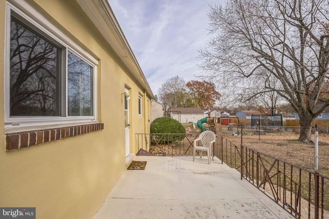 view of patio featuring a playground