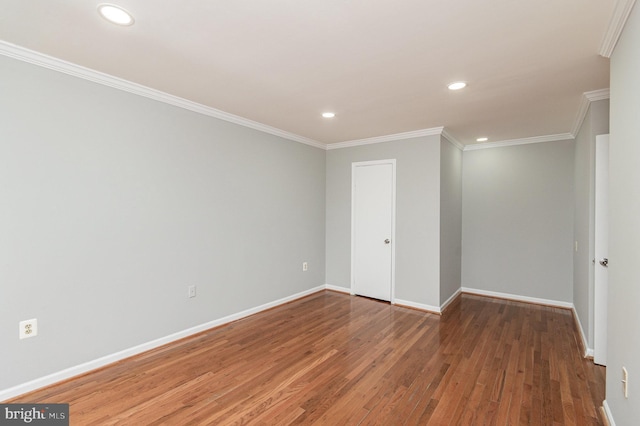 unfurnished room with wood-type flooring and ornamental molding