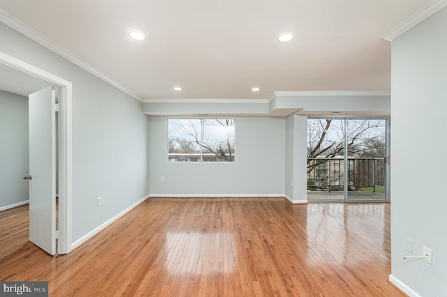 unfurnished room featuring light wood-type flooring and ornamental molding