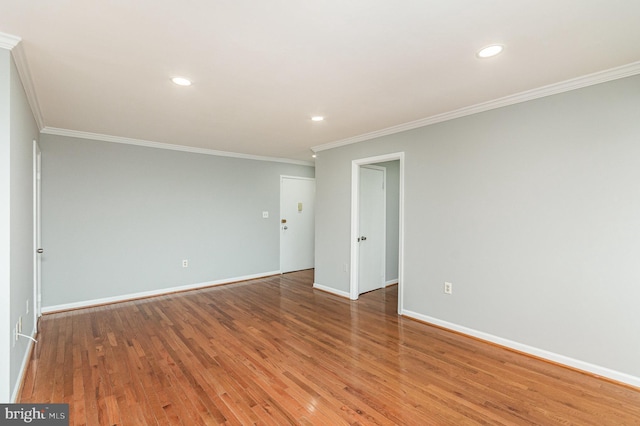 unfurnished room featuring crown molding and hardwood / wood-style flooring