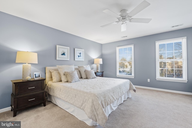 carpeted bedroom with ceiling fan