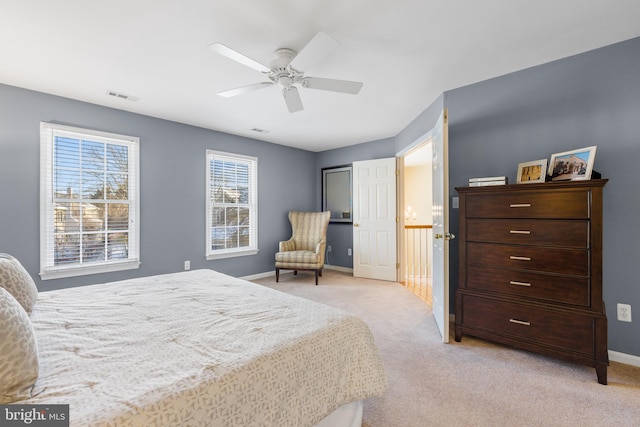 carpeted bedroom featuring ceiling fan