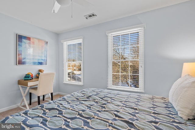 bedroom featuring ceiling fan and carpet