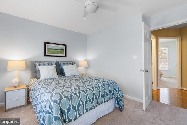 carpeted bedroom featuring ceiling fan