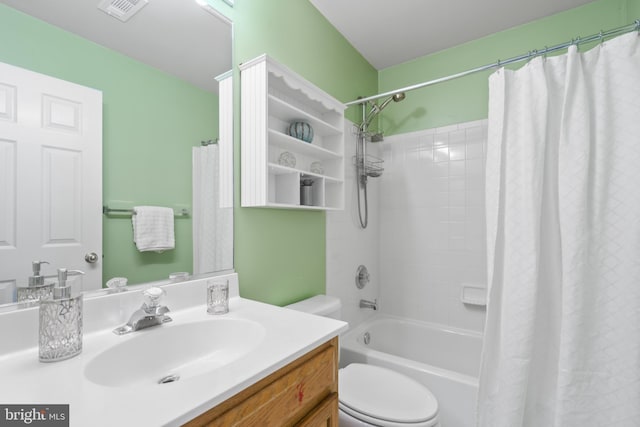 full bathroom with toilet, vanity, and shower / bath combo