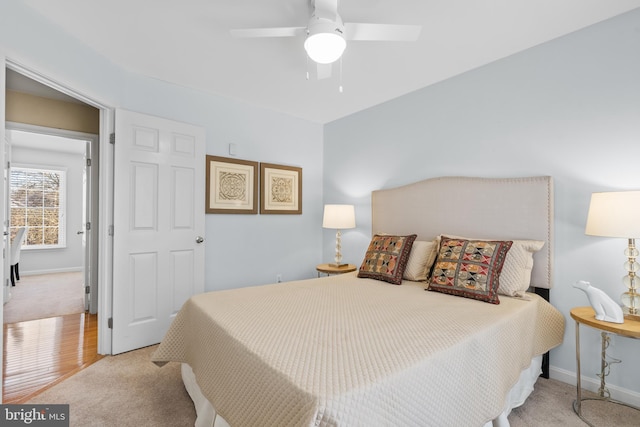 carpeted bedroom with ceiling fan