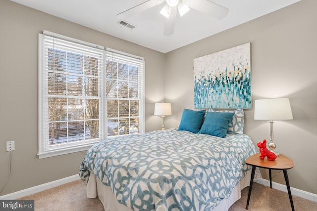 bedroom featuring ceiling fan and light colored carpet