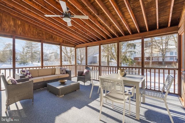 sunroom / solarium featuring ceiling fan, vaulted ceiling, and wood ceiling