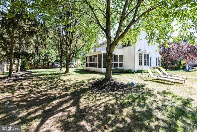 view of yard with a sunroom