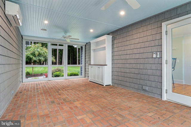 view of patio featuring ceiling fan and a wall mounted AC