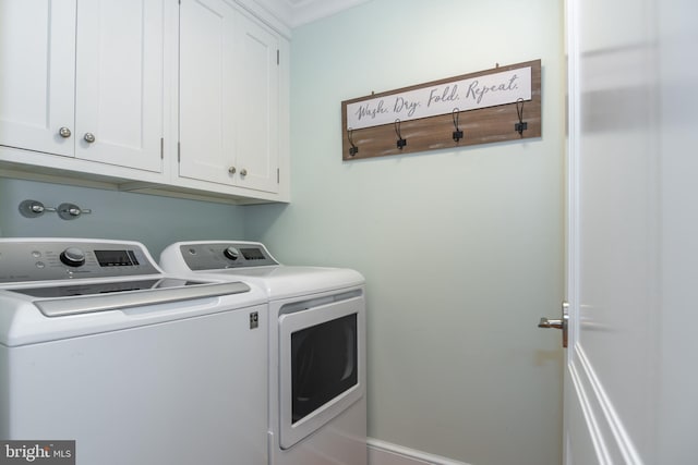 laundry room featuring cabinet space and separate washer and dryer