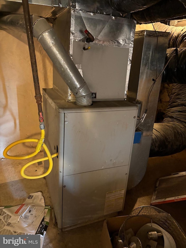 utility room with heating unit