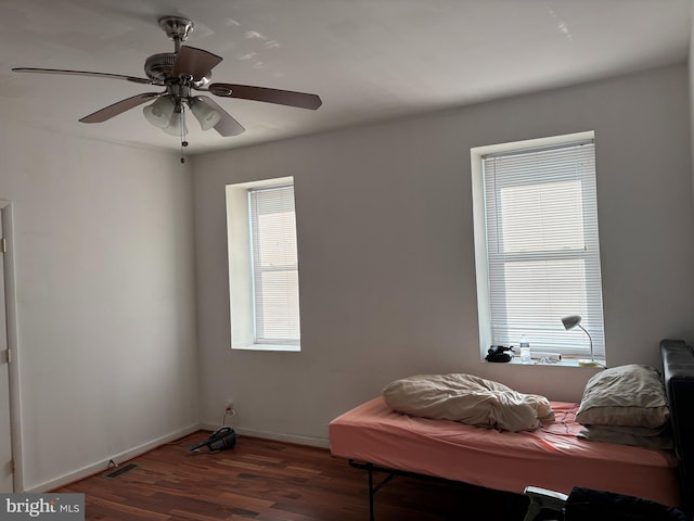 bedroom featuring ceiling fan and dark hardwood / wood-style flooring